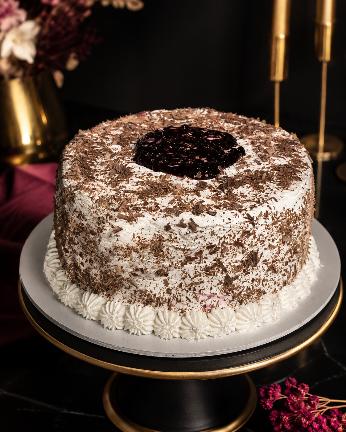 Chocolate flake cream cake with a berry centre