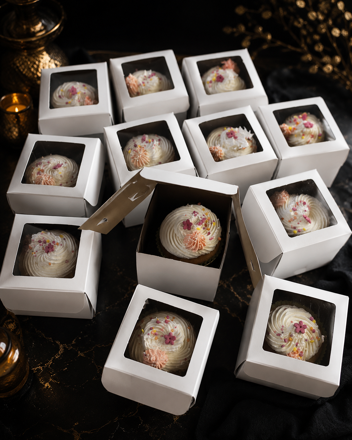 Cupcakes boxed individually in window boxes