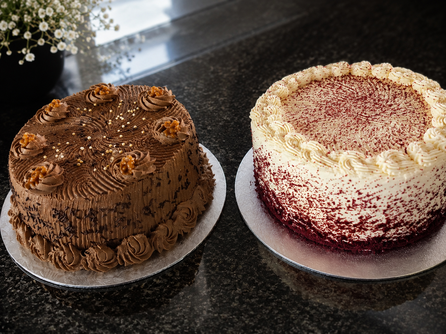 A chocolate cake and a red velvet cake side by side