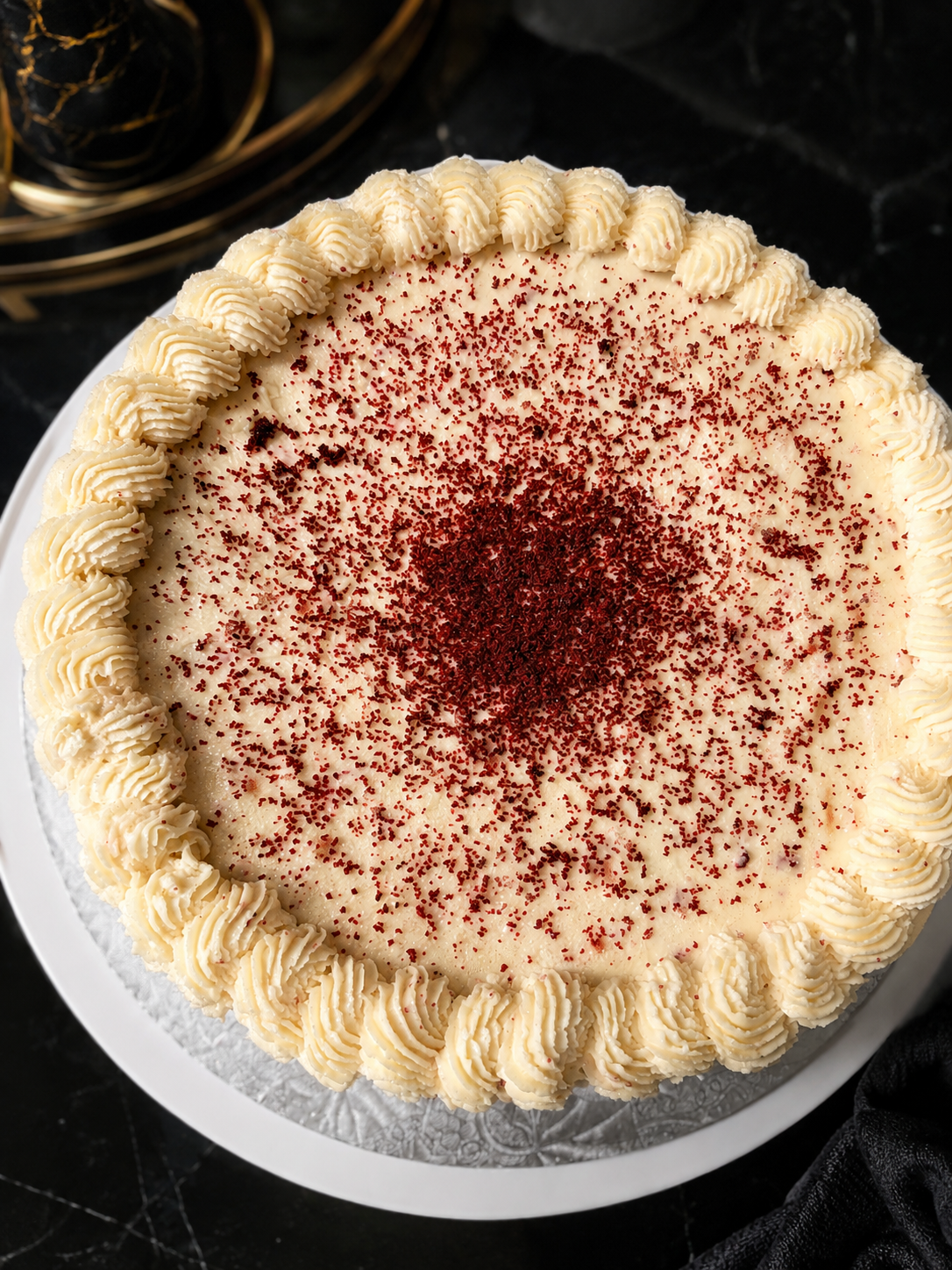 Red velvet cake finished with cream cheese frosting, top view